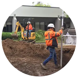 Construction workers digging
